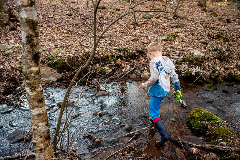 child playing in stream