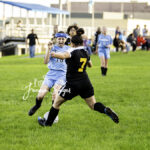 Sullivan West and Fallsburg soccer players battle for the ball on the field in Lake Huntington