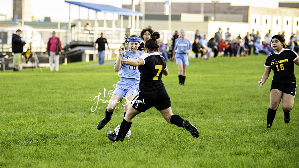 Sullivan West and Fallsburg soccer players battle for the ball on the field in Lake Huntington